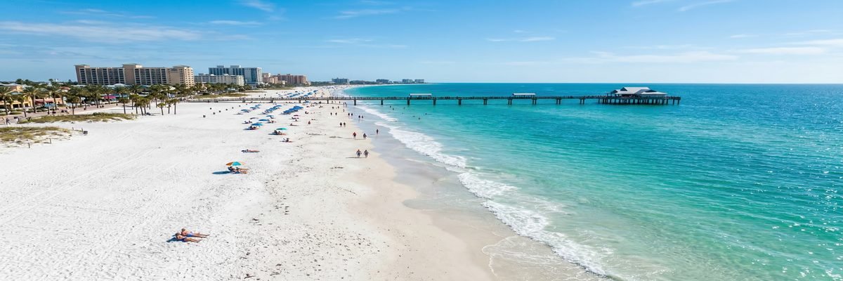 Clearwater Beach, Florida white sand beach with turquoise Gulf waters and Pier 60