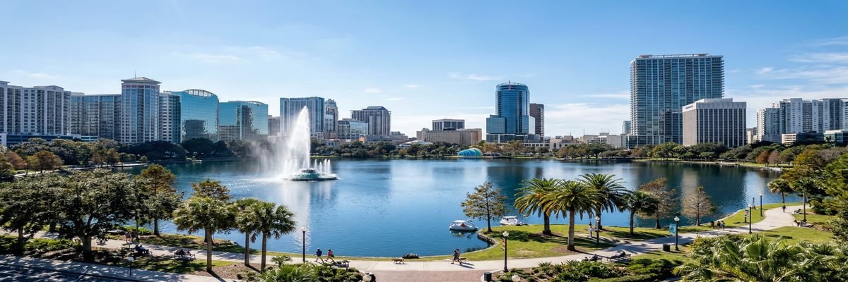 Downtown Orlando, Florida skyline with Lake Eola fountain and surrounding palm trees