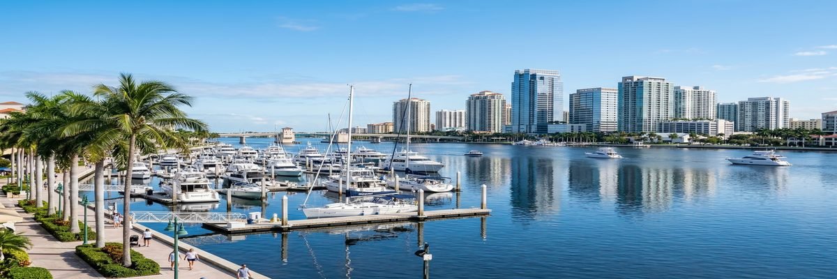 West Palm Beach, Florida marina and waterfront skyline at golden hour